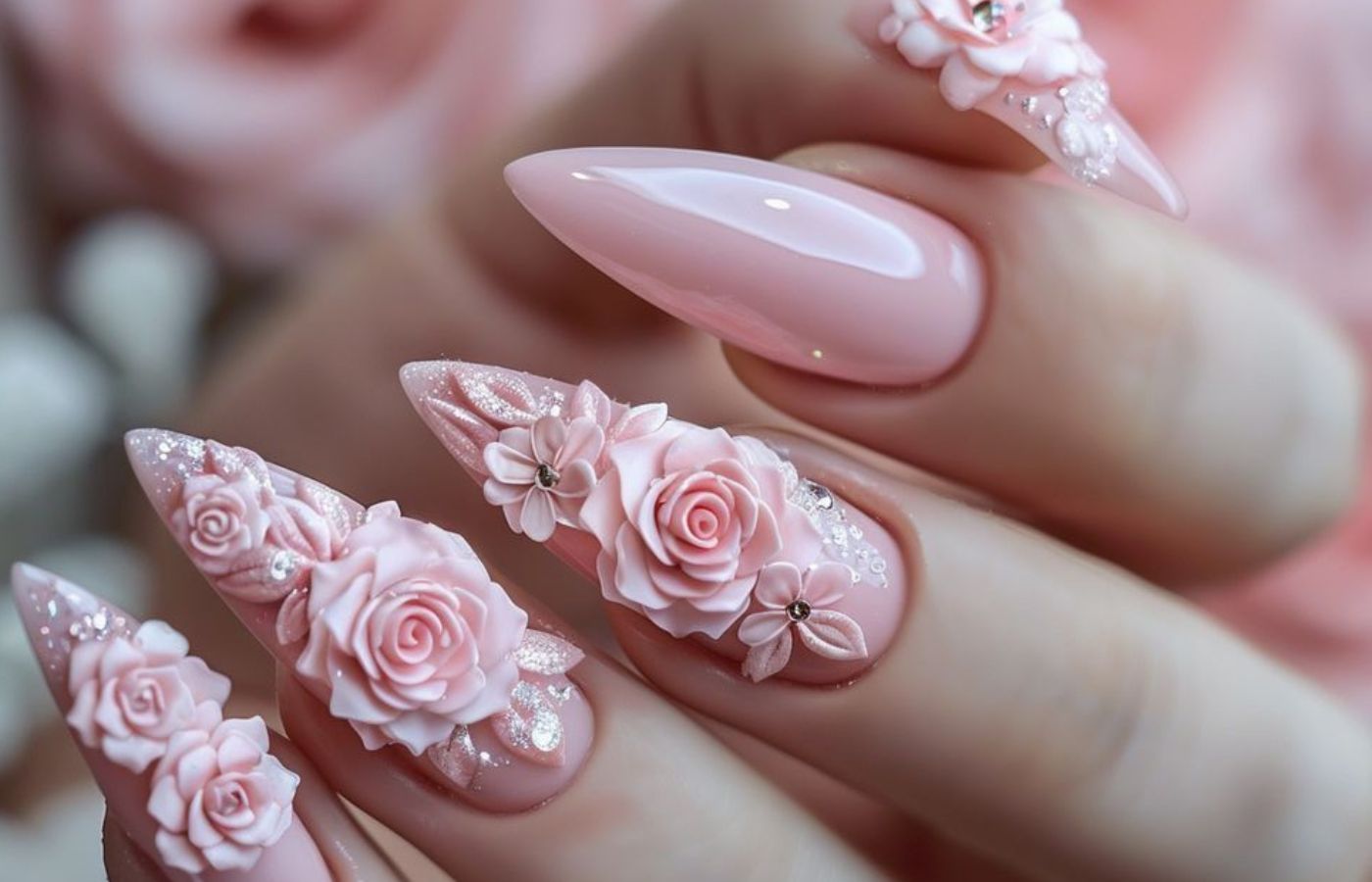 Unhas cor de rosa com aplicações de flores 3D
